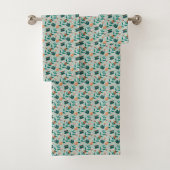 Towels with a teal floral pattern hang 