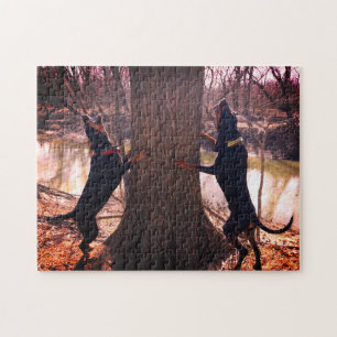 Treing Black & Tan Coonhounds op de rivier Legpuzzel