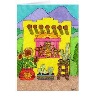 Trois chats dans un Adobe House jaune