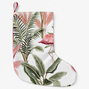 Tropische  roze flamingo, bananenbomen en kleine kerstsok