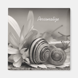 Tuinslakken op een zeeflap met naam magneet