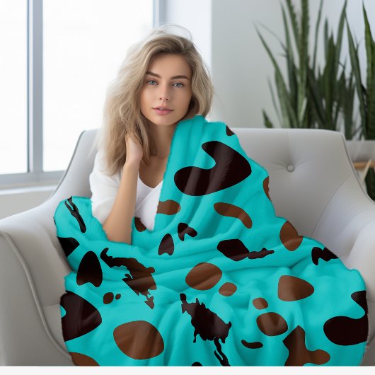Turquoise koe print fleece deken