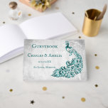 Turquoise Peacock Leaf Vine Mariage Livre d'or<br><div class="desc">Enregistrez les invités à votre grande journée avec un livre d'or Peacock Leaf Vine Wedding Day Turquoise. Le design du livre d'or est orné d'un arrière - plan gris clair avec un paon turquoise animé orné d'une feuille de vigne. Papier à lettres mariage supplémentaire disponible avec cette conception aussi. Vous...</div>