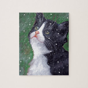 Tuxedo-kat die op sneeuwvlokken kijkt, schildert legpuzzel