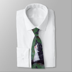 Tuxedo-kat die op sneeuwvlokken kijkt, schildert stropdas