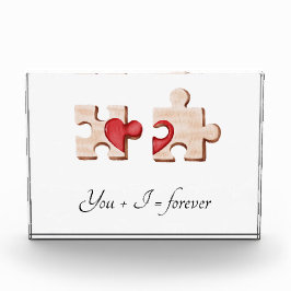 Twee bijpassende puzzelstukjes met een rood hart fotoblokken