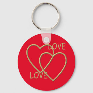 Twee gouden liefhebbende harten sleutelhanger