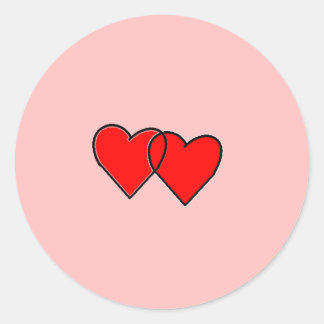 Twee in elkaar grijpende harten ronde sticker