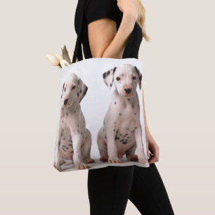 Twee kleine zwarte en witte Dalmatische Puppies Tote Bag