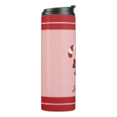 Twee rode en witte snoepjes en naam thermosbeker (Gedraaid links)