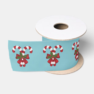 Twee rode en witte snoepstokken op blauw lint