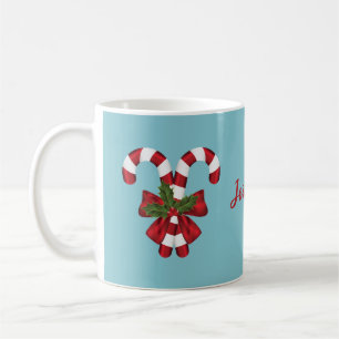Twee rode en witte snoepstokken op blauw met naam koffiemok
