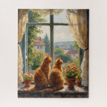 Twee rode katten die uit een raam staren