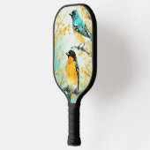 Twee vogels zittend op boomtak pickleball paddle (Links)