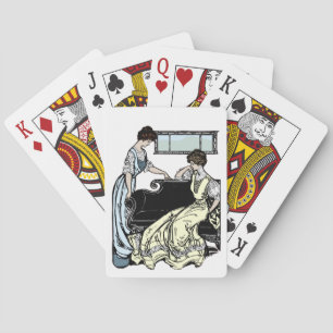 Twee vrouwen met een lange japonnen die kaarten sp