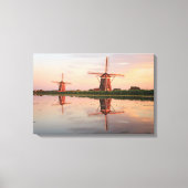 Twee windmolens met reflectie bij zonsondergang canvas afdruk (Voorkant)