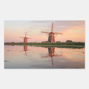 Twee windmolens met reflectie bij zonsondergang rechthoekige sticker