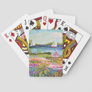 Twee zeilboten en een huisje pokerkaarten