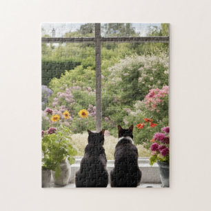 Twee zwarte katten bloemen tuin puzzel