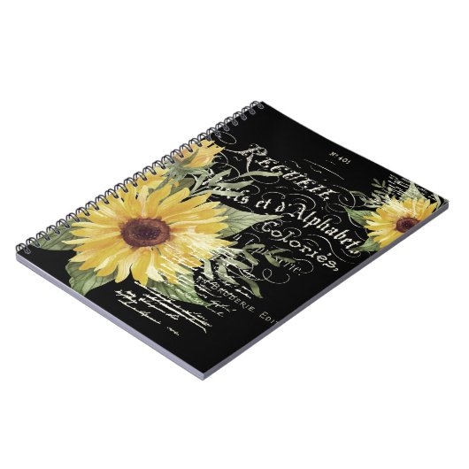 typografie en zonnebloemen op zwart notitieboek (Linkerzijde)