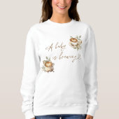 Un bébé brasse un Sweatshirt blanc | Café bébé (Devant)