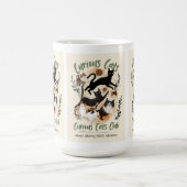 un chat et une tasse chaude à la main (Centre)
