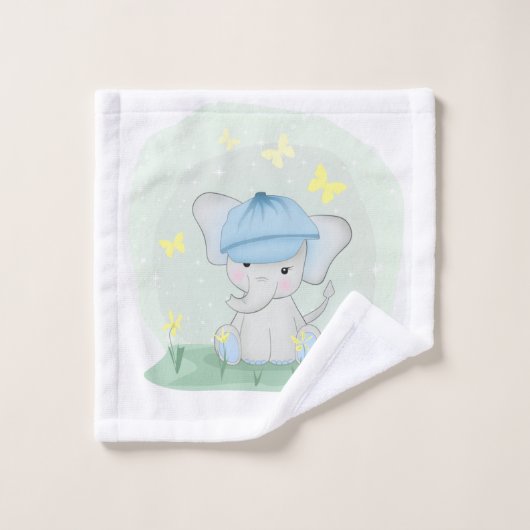Un joli éléphant dans un pré fleuri. (Gant de toilette)