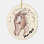 Un ornement en céramique en forme de cheval monté (Gauche)