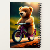 Un ours en peluche à vélo sur un Carnet (Verso)