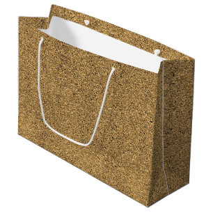 Un sac en papier brun avec une poignée blanche