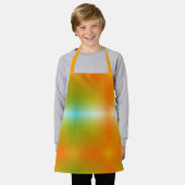 Un tablier vibrant avec un vert, orange et jaune. (Porté)