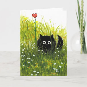 Une carte de chat noir de Valentine d'amour par