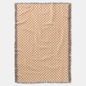 Une couverture à carreaux avec des carrés orange (devant Vertical)