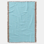 Une couverture à carreaux bleu clair et blanc (devant Vertical)