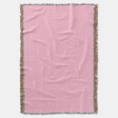 Une couverture tissée rose avec un motif subtil (devant Vertical)