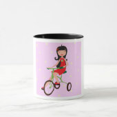 Une Fille Qui Mène Une Mug À Vélo (Centre)