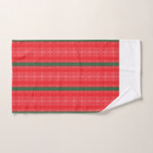 Une pomme rouge vif est posée sur une surface blan (Serviette à main)