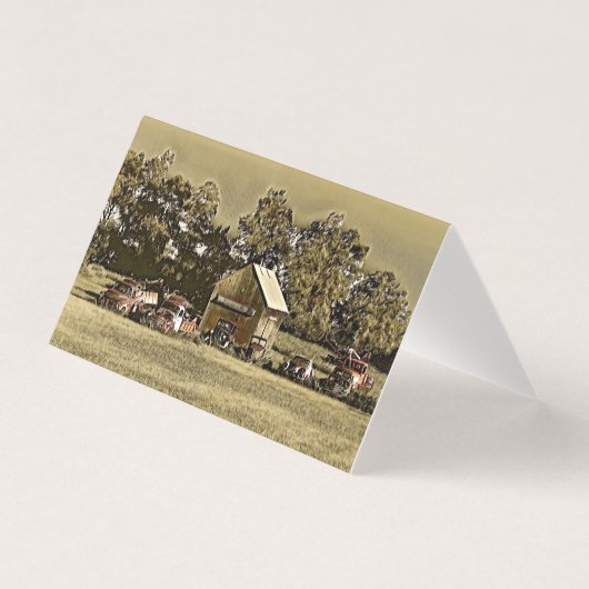 Une rangée de jalopies dans l'herbe. (Front)