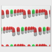 Unieke groene pil tussen rode capsules cadeaupapier (Vlak)