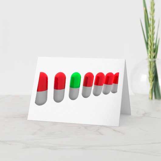 Unieke groene pil tussen rode capsules kaart