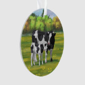 Vache Holstein et veau mignon en pâturage d'été (devant)