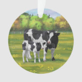 Vache Holstein et veau mignon en pâturage d'été (devant)