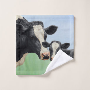 Vache Holstein noire et veau mignon