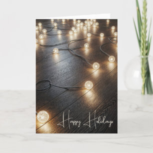 Vakantielichten op een houten vloer feestdagen kaart