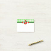 Vakantieppermints rood en groen post-it® notes (Op bureau)