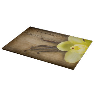 Vanilla Pods and Flower over Wooden Background Snijplank
