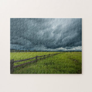Veld met een houten hek legpuzzel