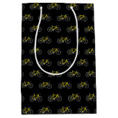 Vélo jaune sur sac cadeau moyen noir (Devant)