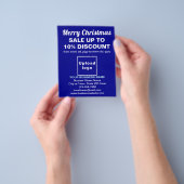 Vente de Noël d'affaires sur prospectus bleu (main)