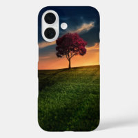 Verbluffend landschap met een rode boom op zonsond